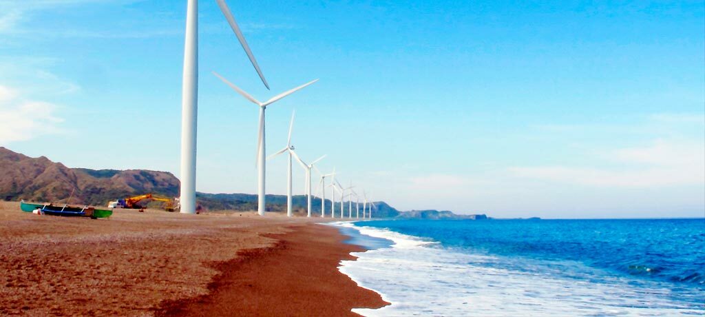 windmills along the ocean shoreline