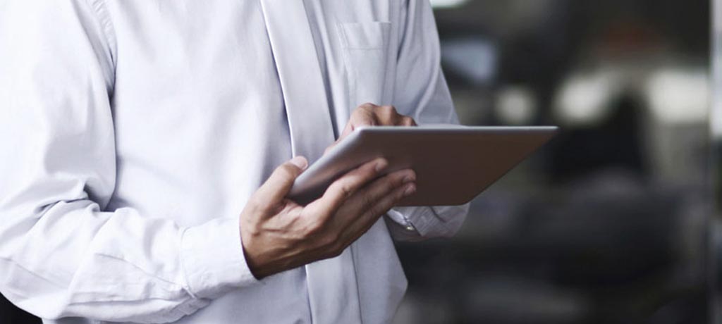 Man reading on his tablet 